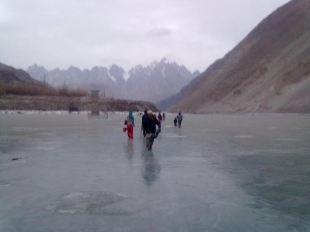 Gulmit: People are crossing the dammed river 