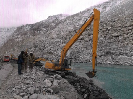 Attabad: An excavator machine working at the spillway. Photo taken on January 14, 2013
