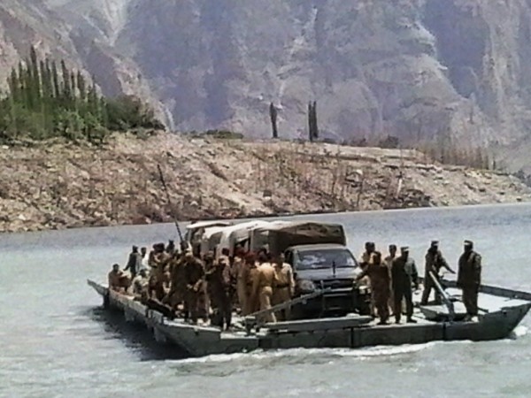 The medical team of Pakistan Army arriving in Gulmit at a raft 