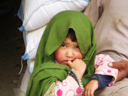 A Balti baby girl at a roadside shop