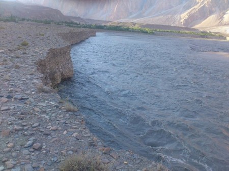 Photograph showing massive erosion of riverbank in Passu. Photo Courtesy: Shah Wali
