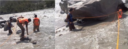 Workers of Rescue 1122 searching in the Gilgit river for the missing woman 