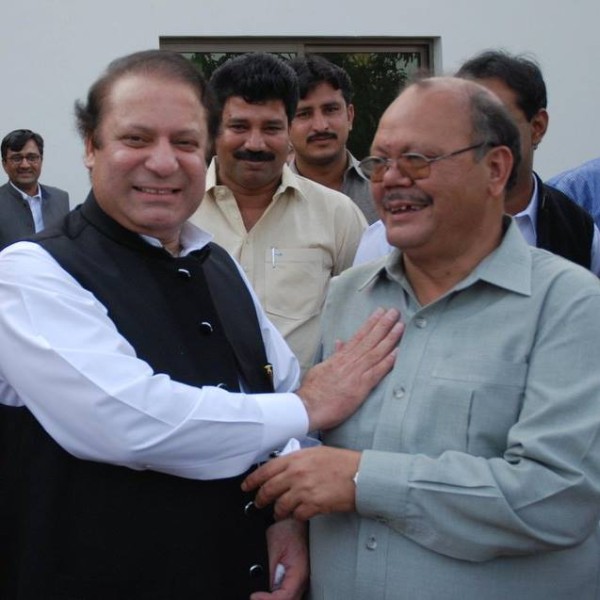 The Prime Minister sharing a light moment with Zulfiqar Balti