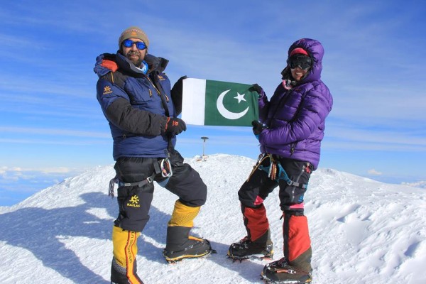 Mirza and Samina holding the Pakistani flag on top of Mt. McKinley 
