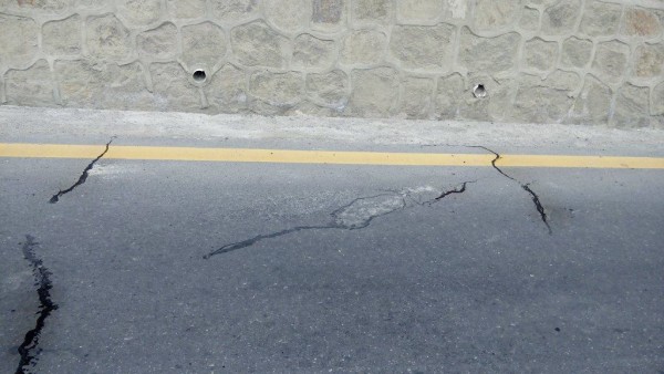 Cracks, with water seeping out 