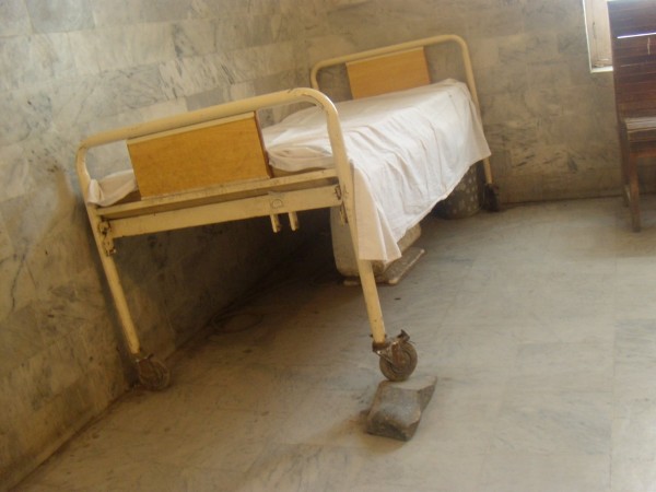 A bed for the patients has been balanced on a rock brought from the nearby Hanisara River 