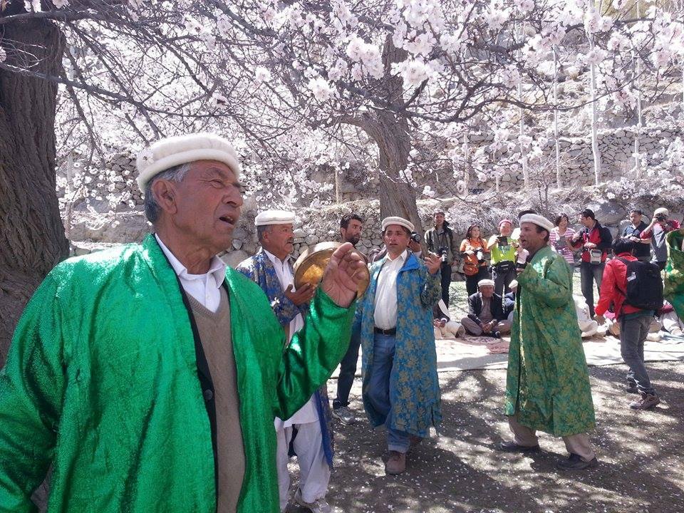 Elders rejoice under the flower laden trees, celebrating spring. Photo: MountainTV.NET