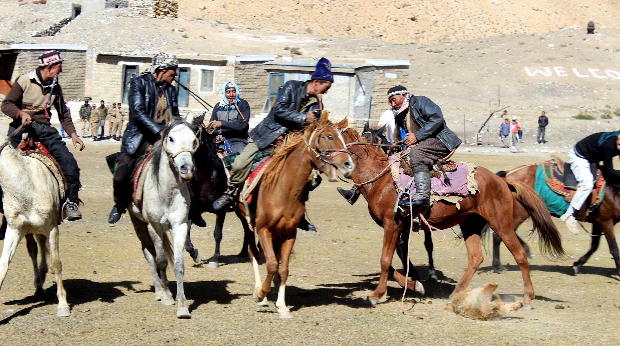 Players from the Wakhn region busy in playing Buzkashi, a traditional game played on horses 
