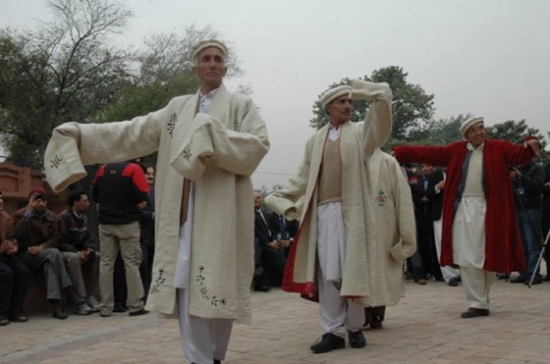 Elders dance wearing Shuqa 