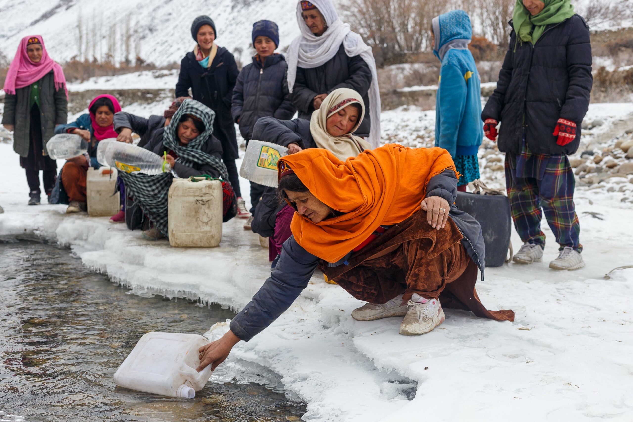 Wakhi women collecting water